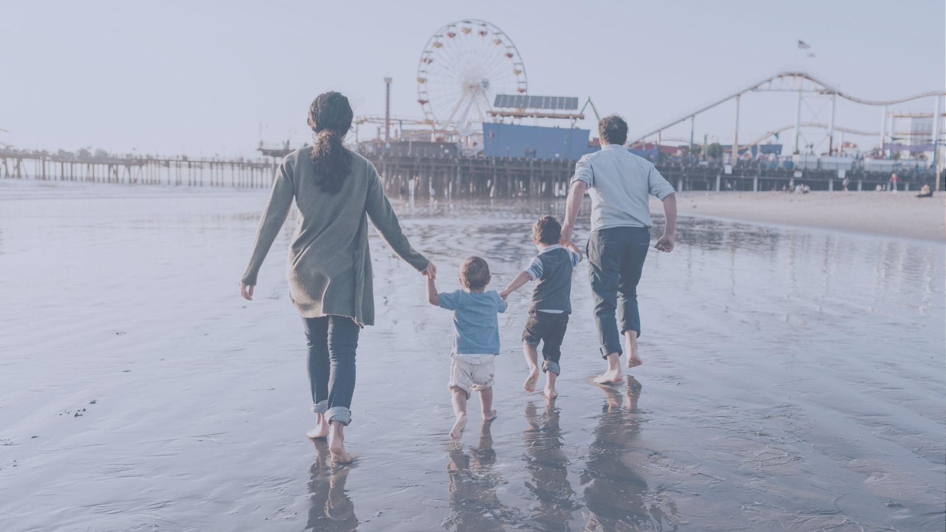Family walking on a California beach, symbolizing family-based immigration, opportunity, and a brighter future in America.